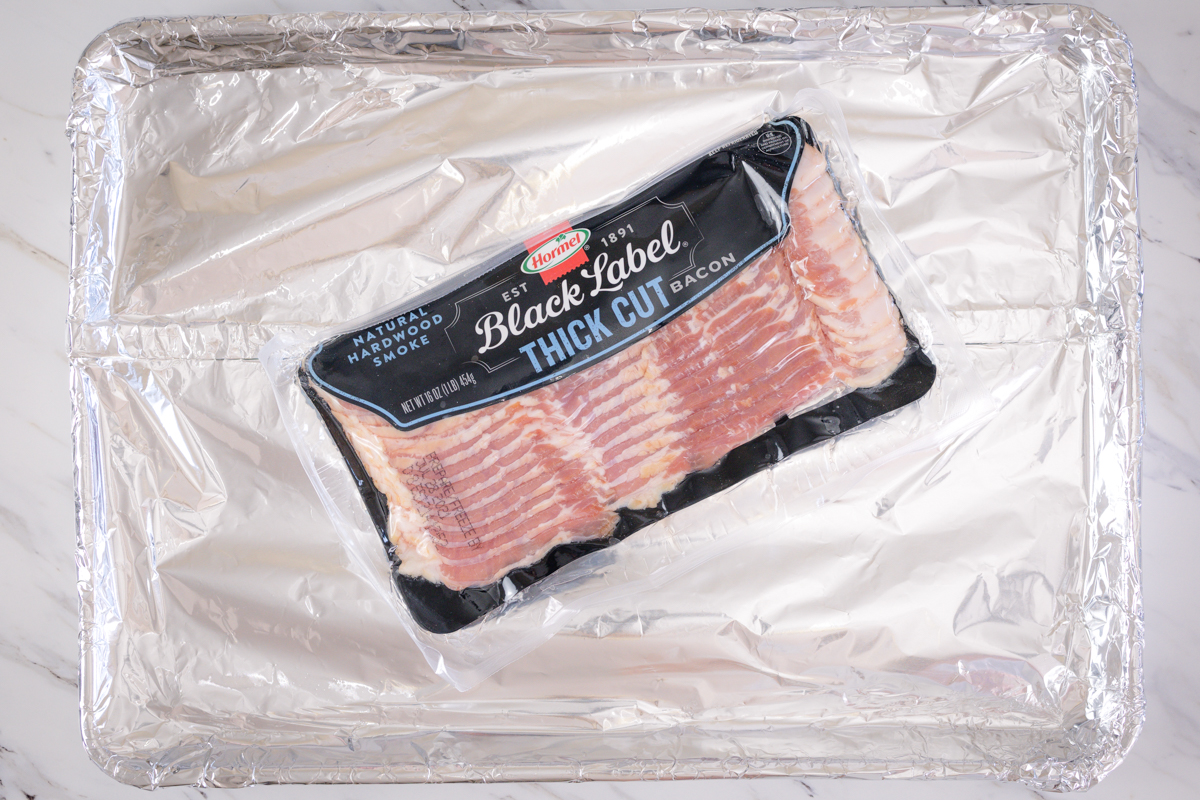 Line baking sheet with foil for baking bacon