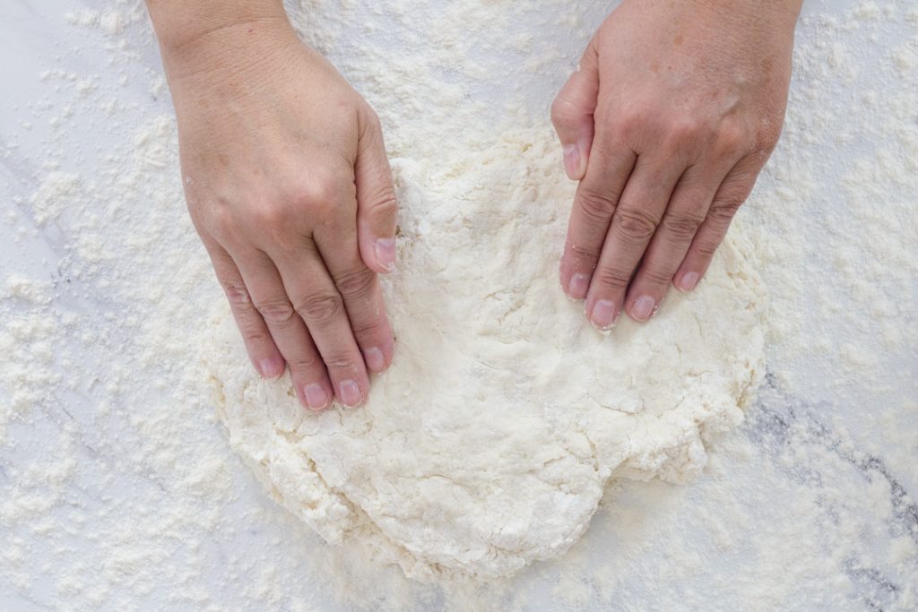 Patting dough for biscuits