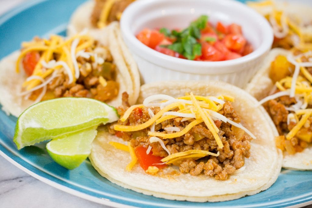 Ground Turkey Tacos on Plate with Salsa and Lime