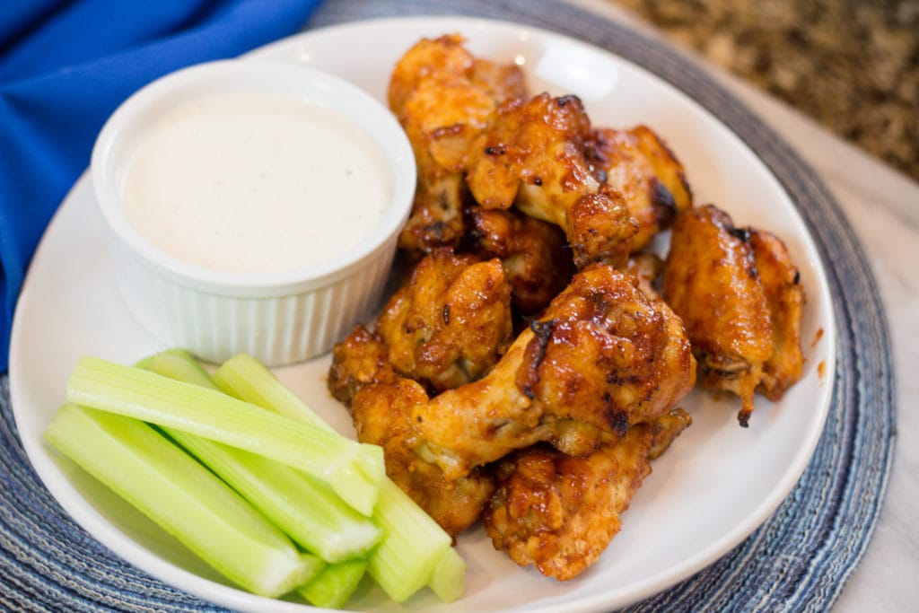 Honey BBQ Chicken Wings on plate with celery