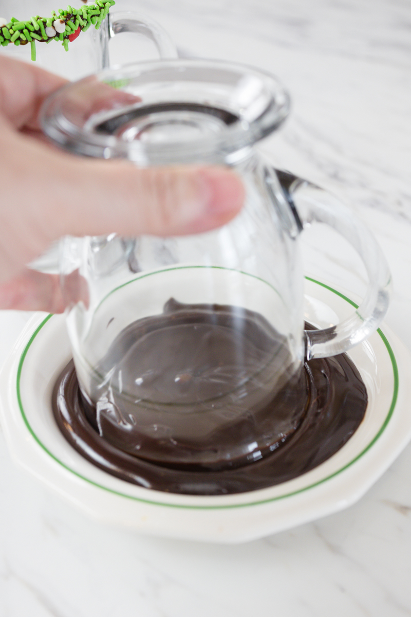 Dip rim of glass into chocolate