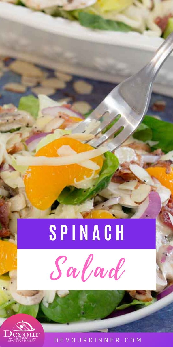 This healthy and delicious spinach salad recipe is topped with mushrooms, swiss cheese, mandarin oranges, and so much more! You're going to love it with my homemade poppy seed dressing and on its own! Make eating right feel great with this simple and filling recipe! #devourdinner #recipe #recipes #yum #yummy #salad #saladrecipe #spinach #spinachsalad #poppyseeddressing #poppyseed #sidedishrecipe #easyrecipe