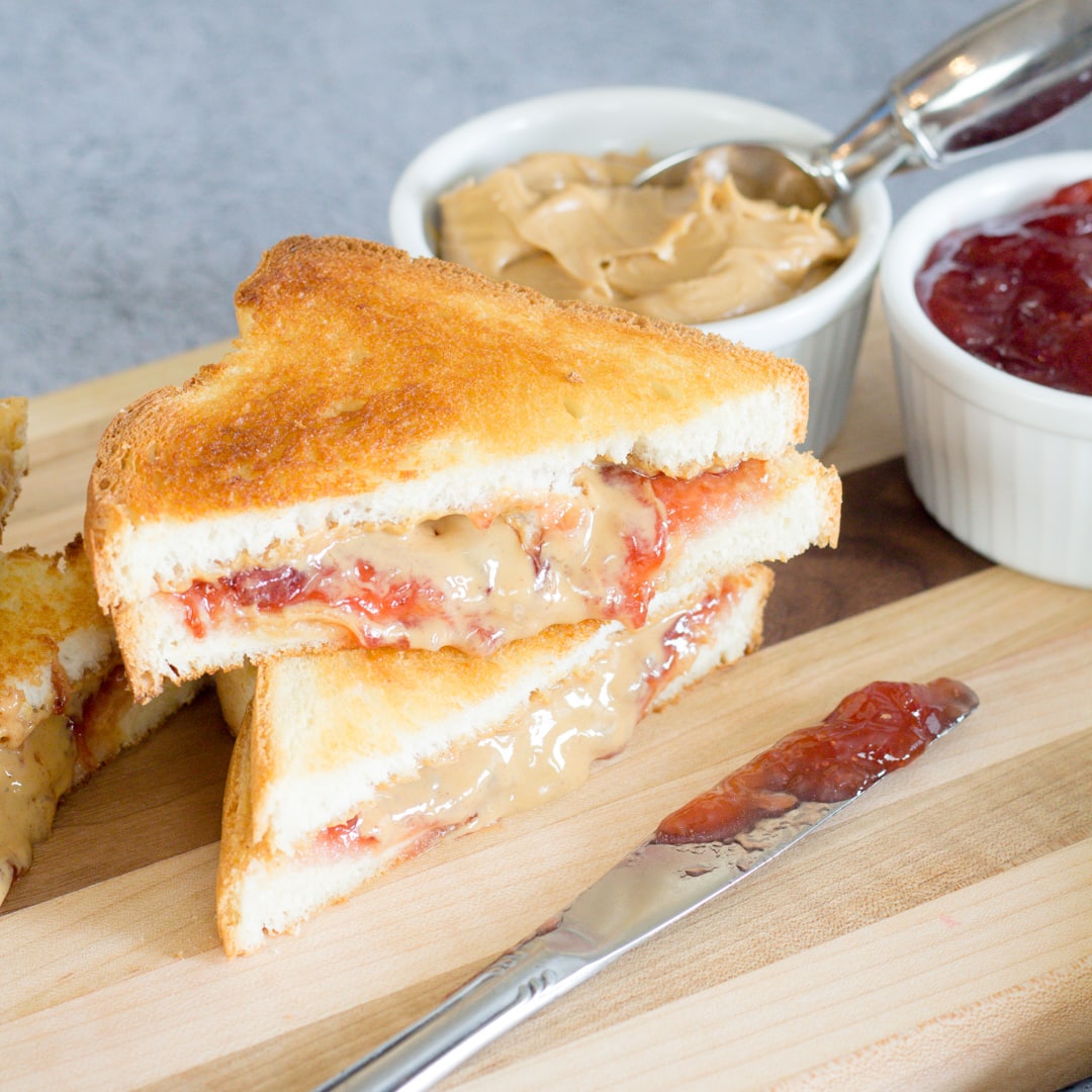 Peanut Butter and Jelly Sandwich on Cutting Board