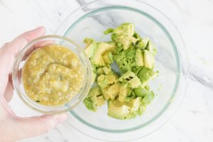 Salsa Verde and cubed avocado in bowl