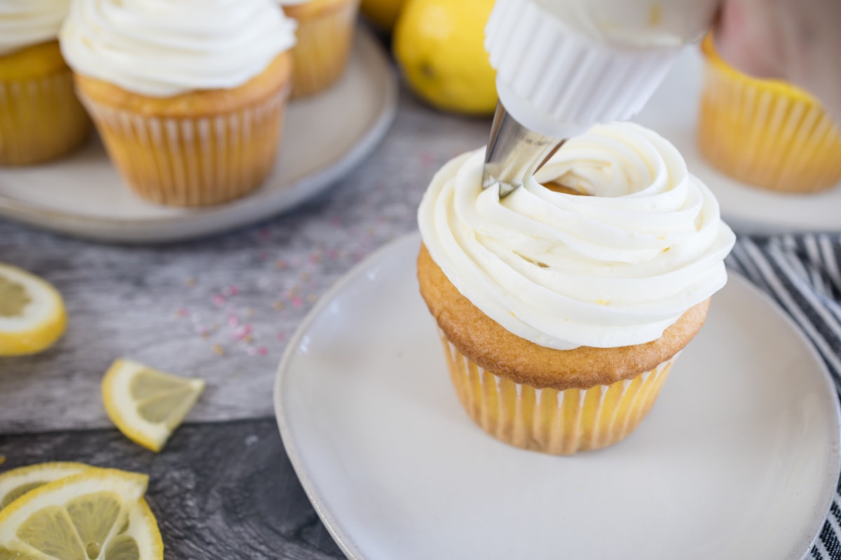 Lemon Cream Cheese Frosting piped onto cupcake
