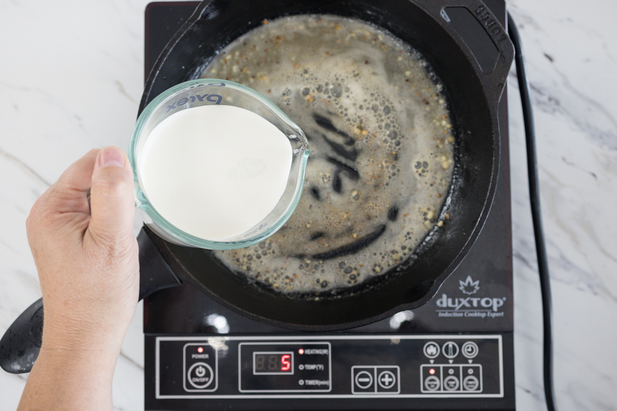 Add milk to roux to create gravy