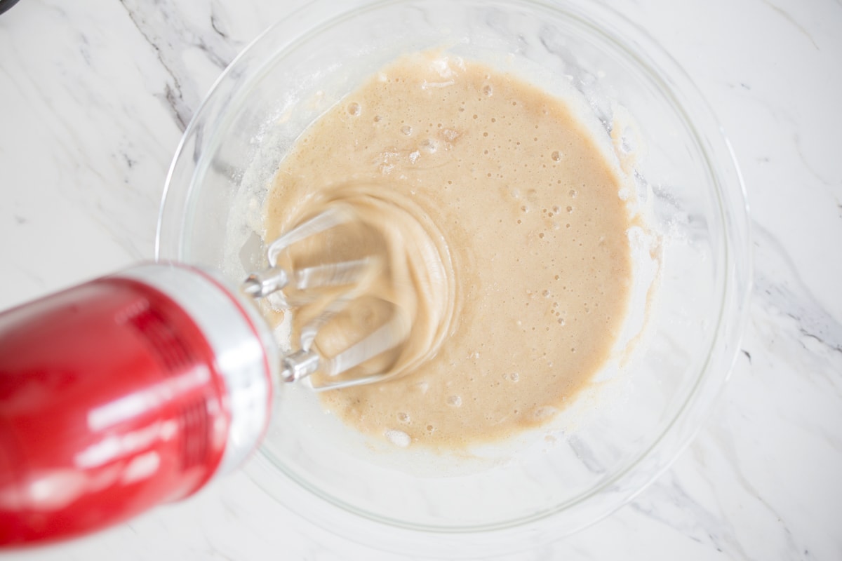 Mix batter for cupcakes with hand mixer