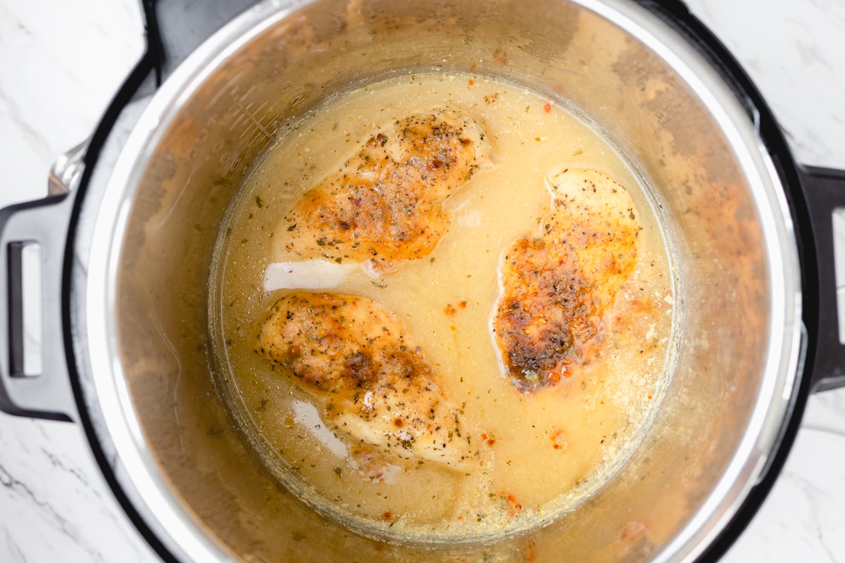 Cooked seasoned chicken in gravy made in Instant Pot