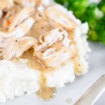 Instant Pot Chicken and Gravy on a white plate.