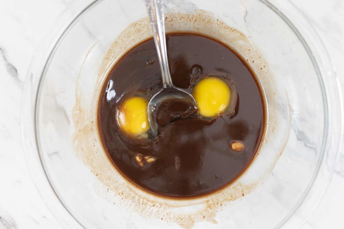 Butter, Chocolate, Eggs and Vanilla mixed in bowl