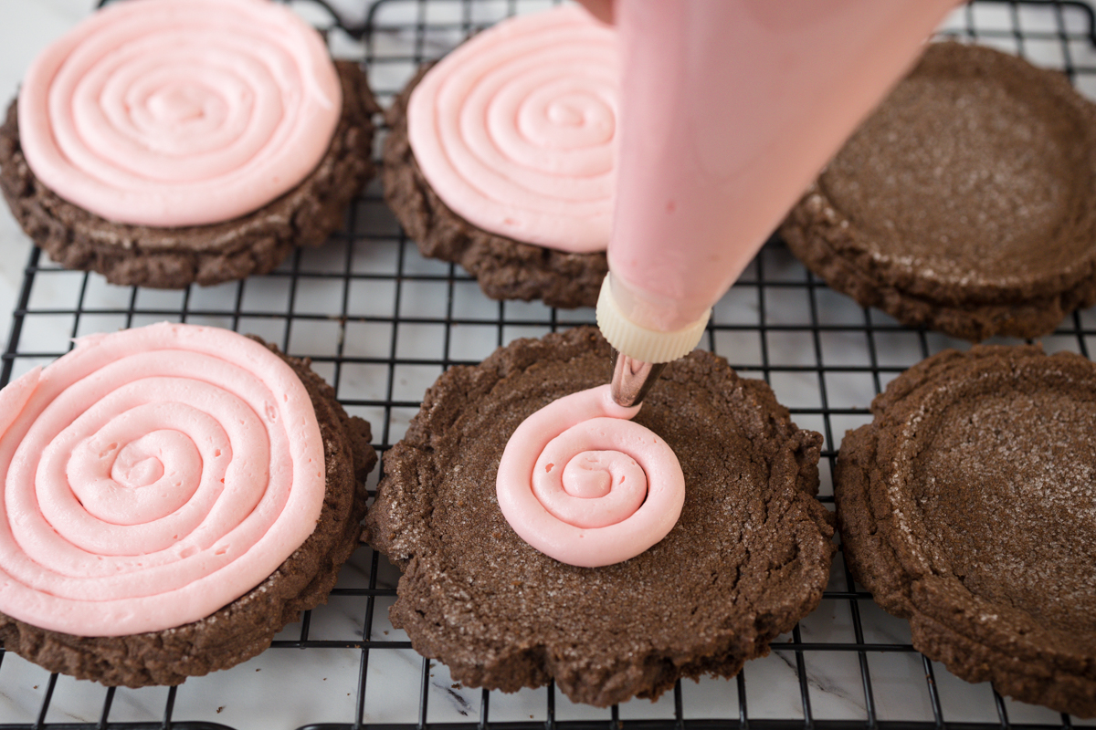 Pink Frosting on Chocolate Swig Cookies