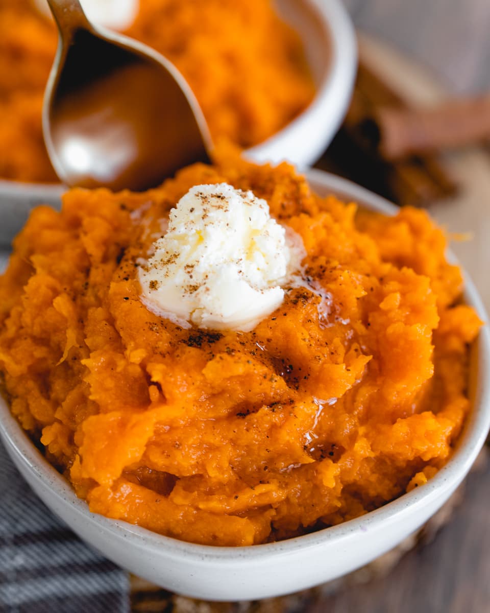 Instant Pot Sweet Potato Mash in bowl with butter and cinnamon
