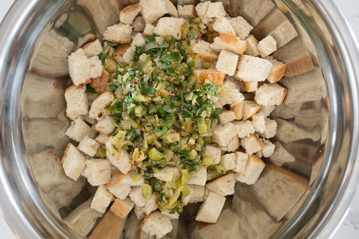 Mix Bread with vegetables in large mixing bowl