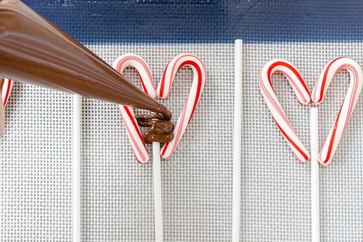 Fill candy cane hearts with chocolate