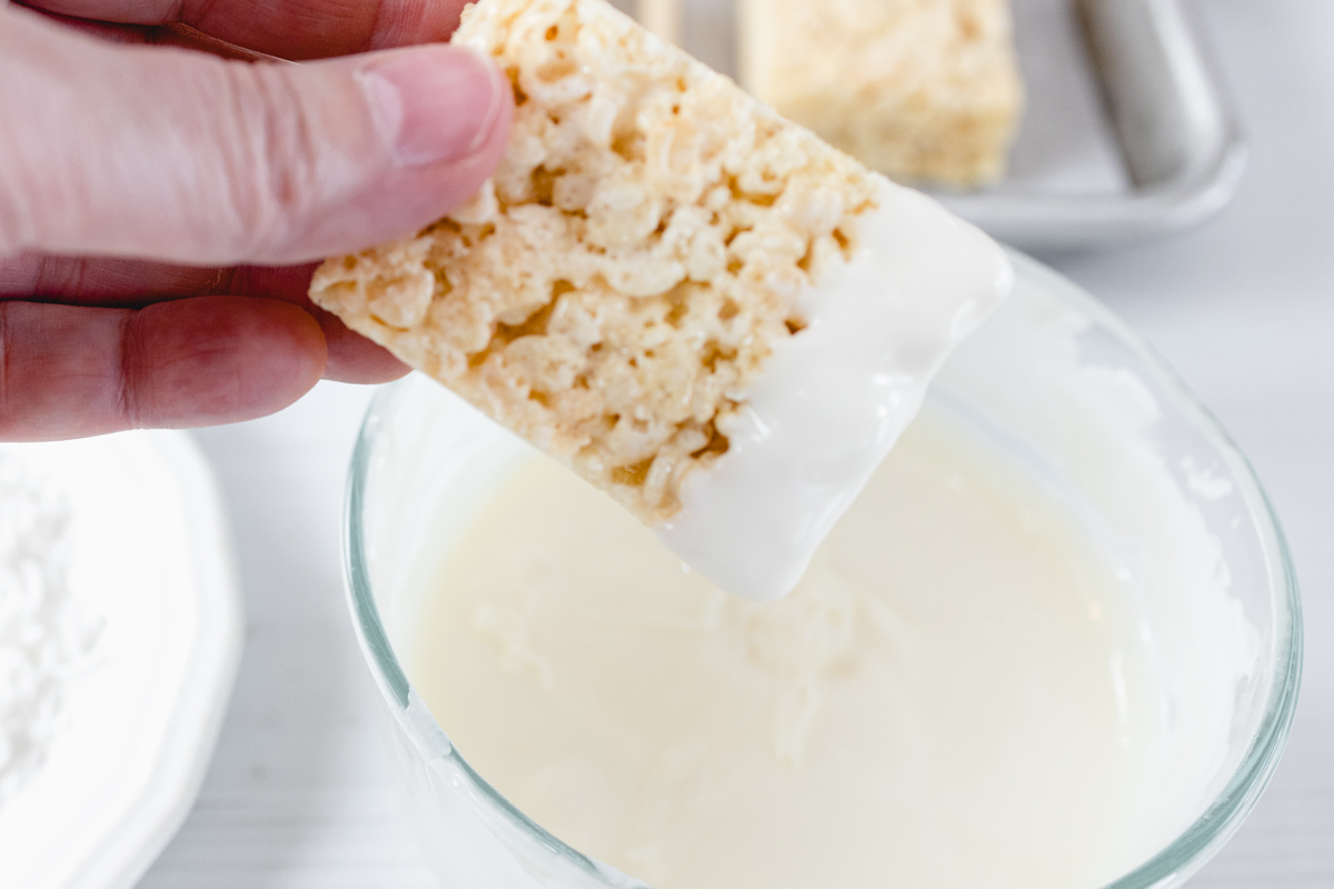 Dip end of rice krispie into white chocolate