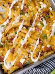 Top view close-up of Bacon Cheesy Fries on a baking tray.