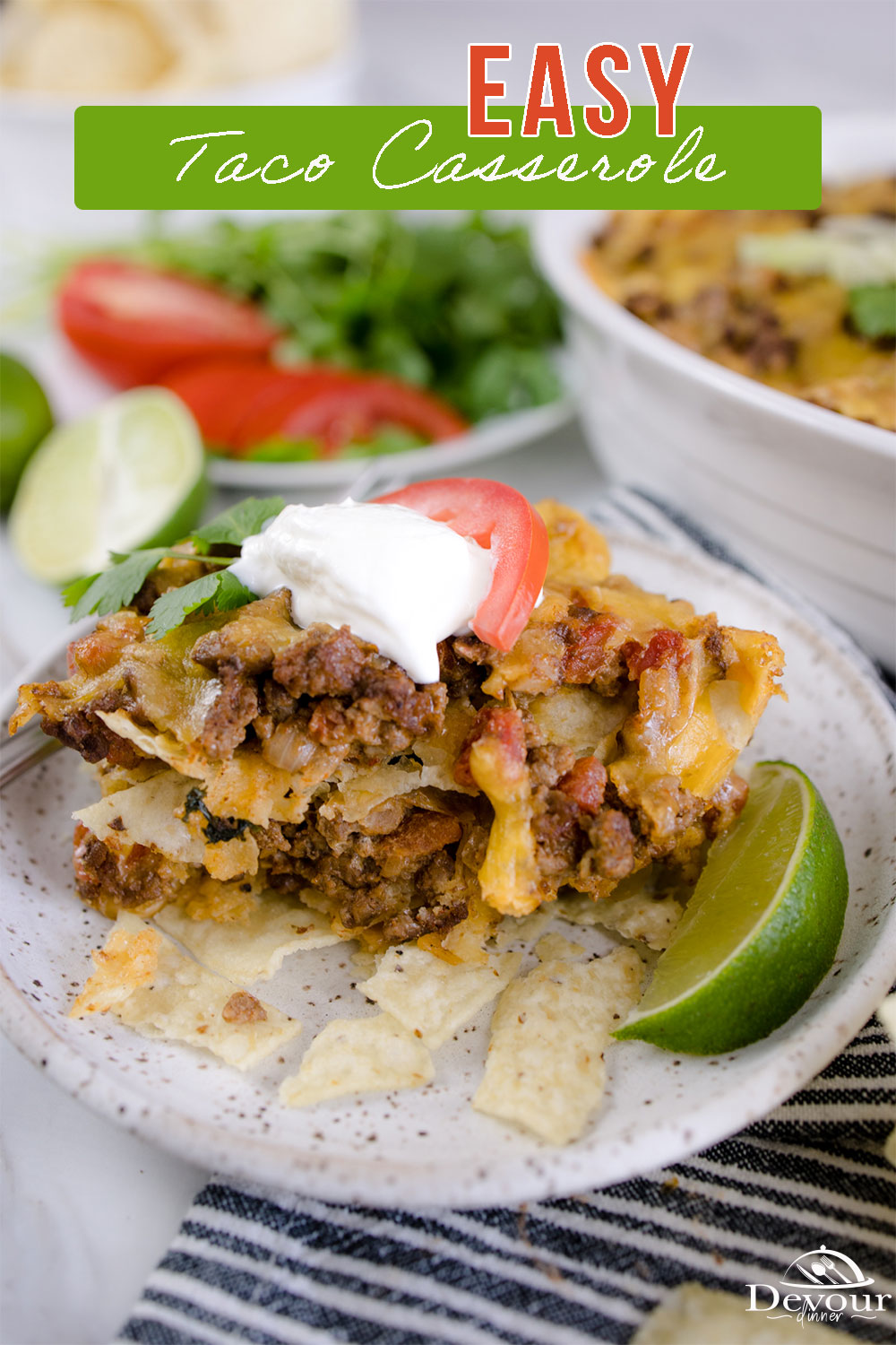This easy Taco Casserole recipe is made with layers of crunchy tortilla chips, well-seasoned ground beef, onion, garlic, and gooey cheese, topped with tangy sour cream, fresh tomatoes, and all your other favorite toppings!