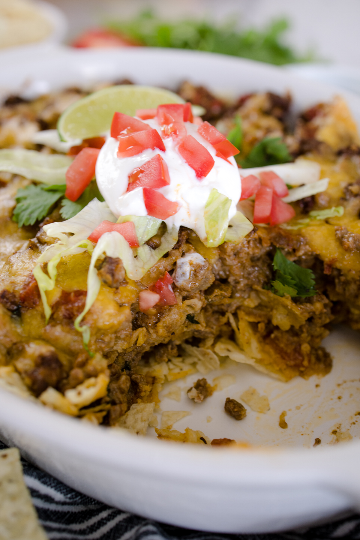 Close-up of Taco Casserole in it's dish with a spoonful taken out of it. 