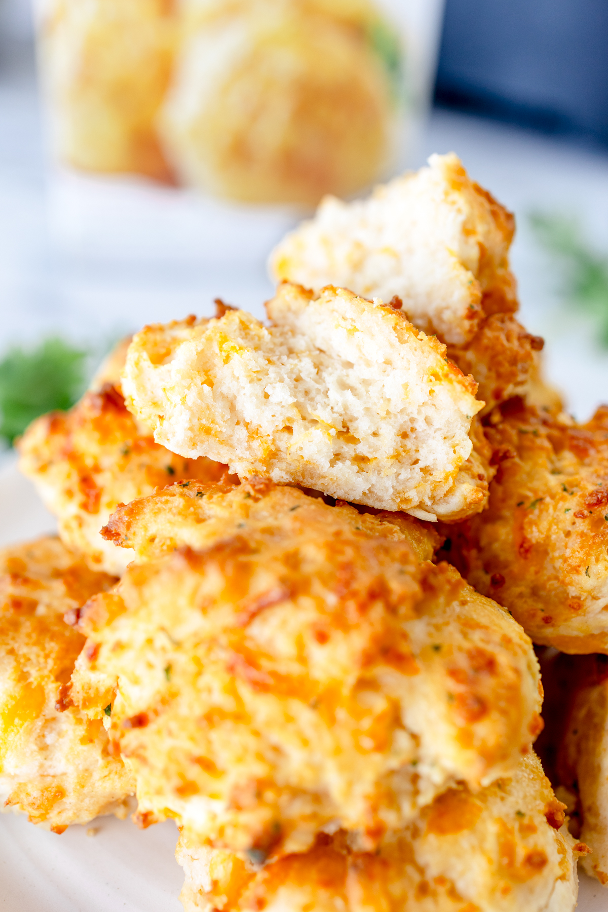 Close up of Red Lobster biscuits in a pile on a white surface.