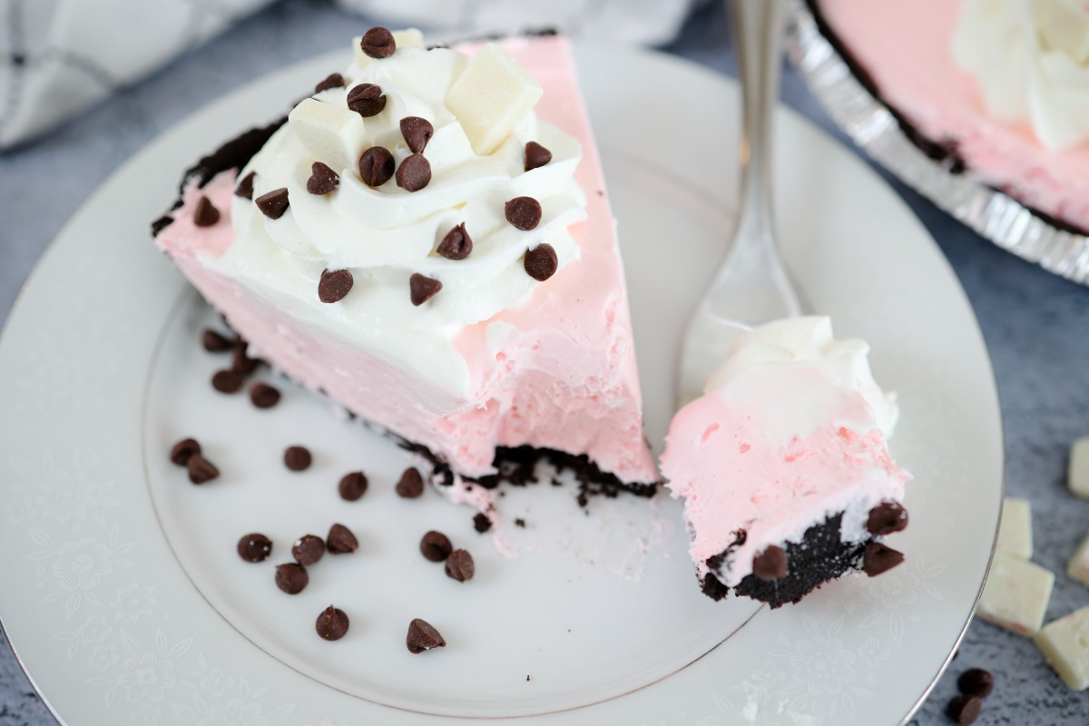 slice peppermint pie on plate with mini chocolate chips