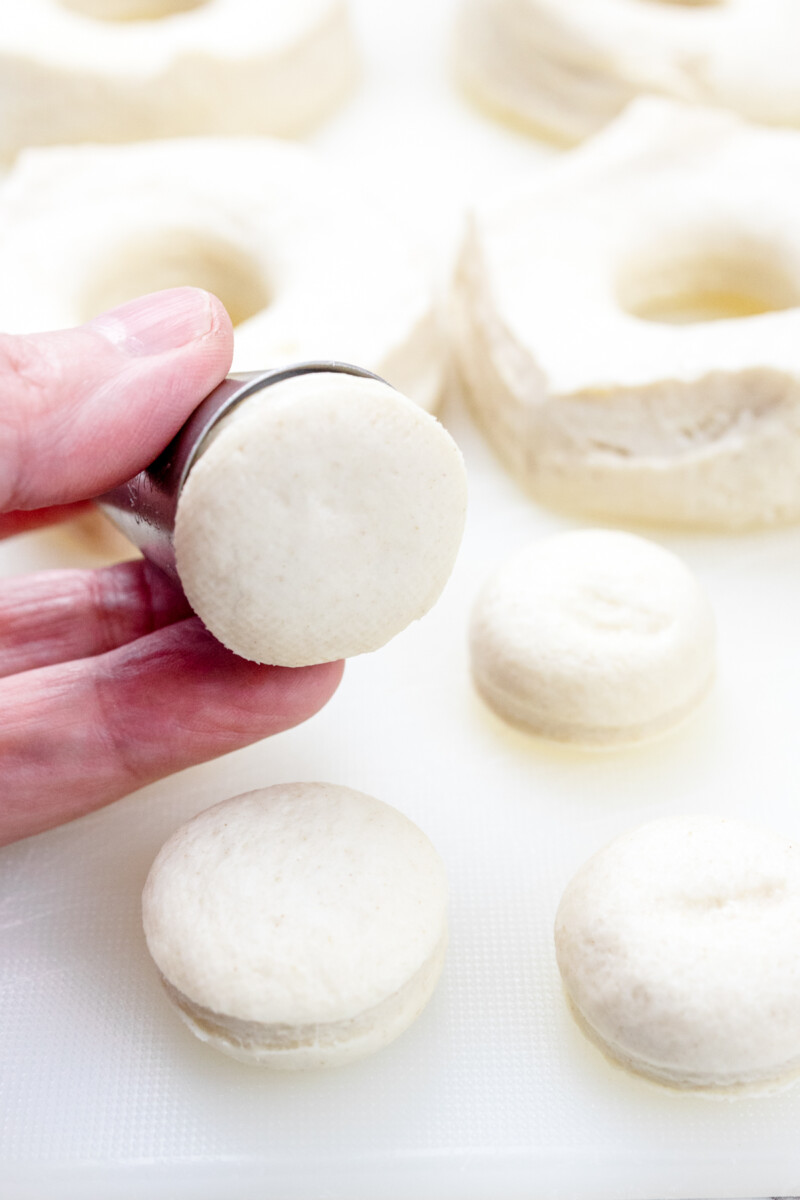 Close view of uncooked biscuit pieces from the holes.