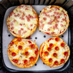 Top view of fried Air Fryer Pizza Bagels in an air fryer.
