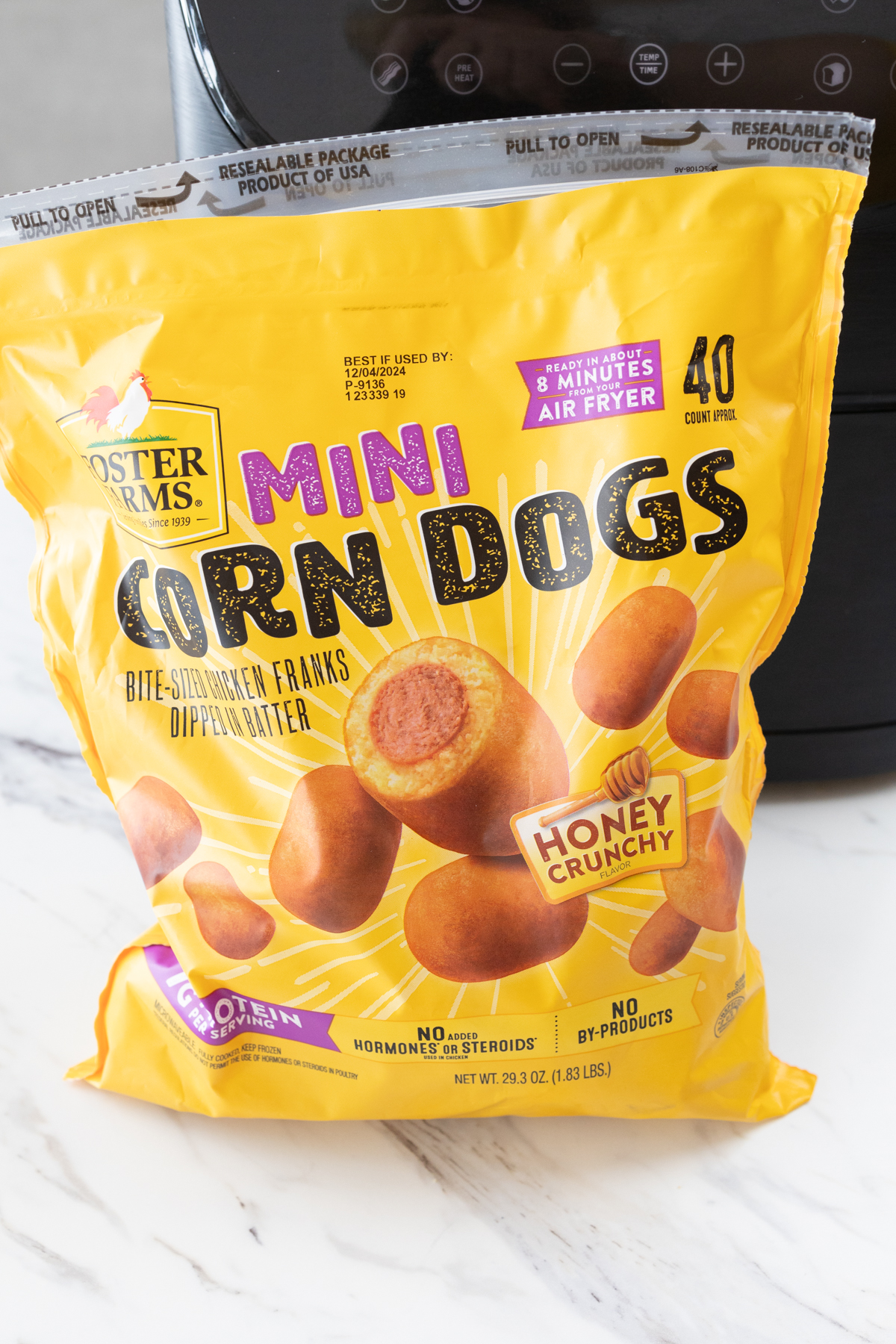 Close view of a bag of mini corn dogs.