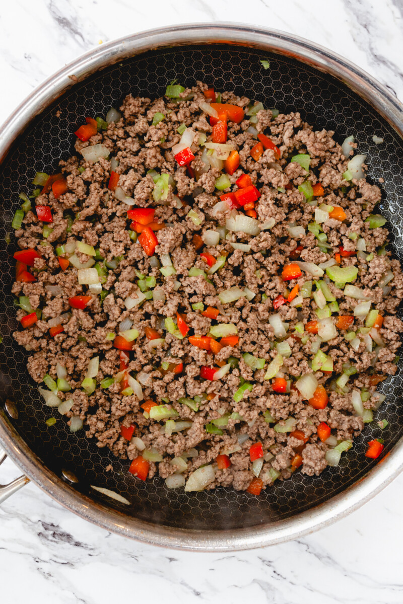 Top view of the pan after the ground beef and vegetables have been sauteed.