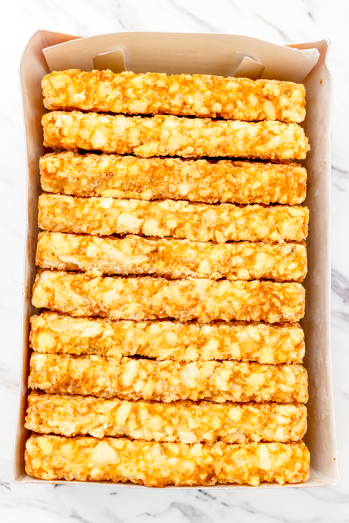 Top view of frozen hash browns in the box.