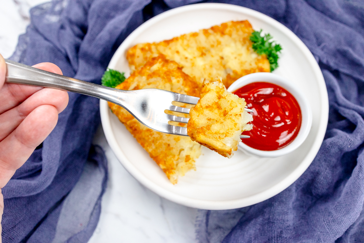 breakfast plate with hash brown patties