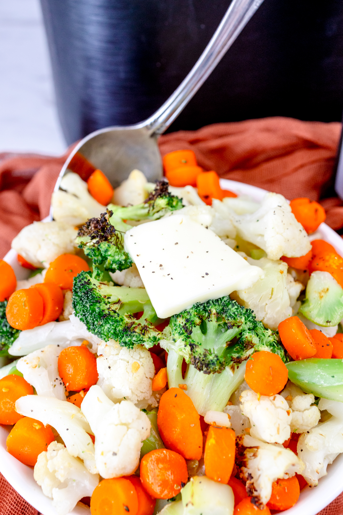 Close up of a dish full of mixed vegetables.