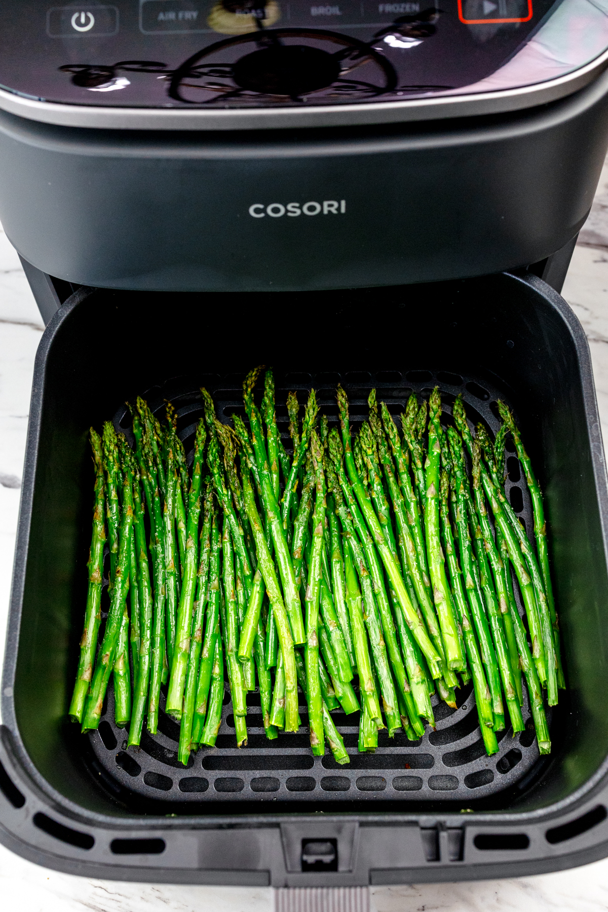 A close up shot of asparagus in the Air Fryer.