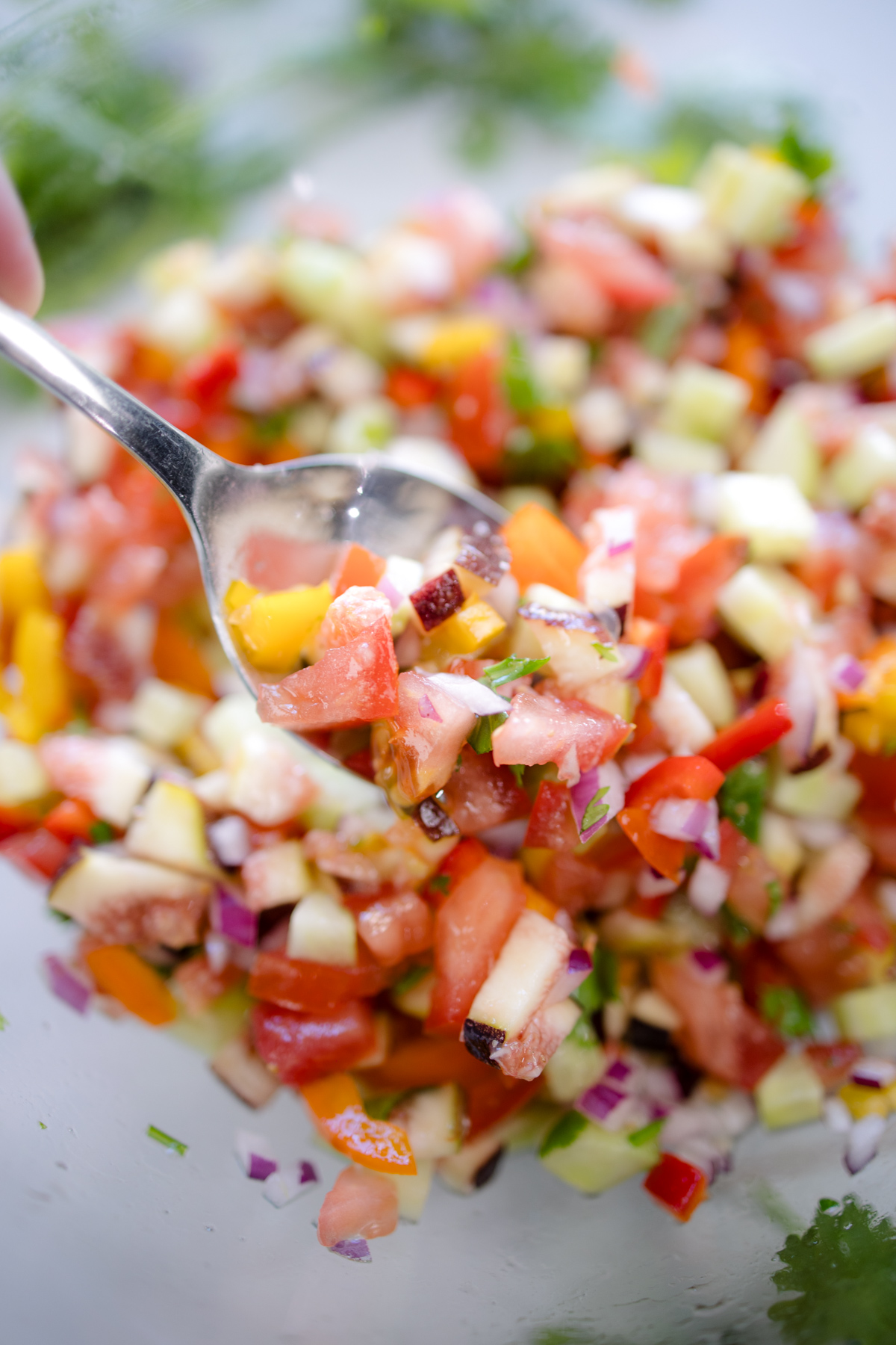 A spoon inserted into Fig Salsa.
