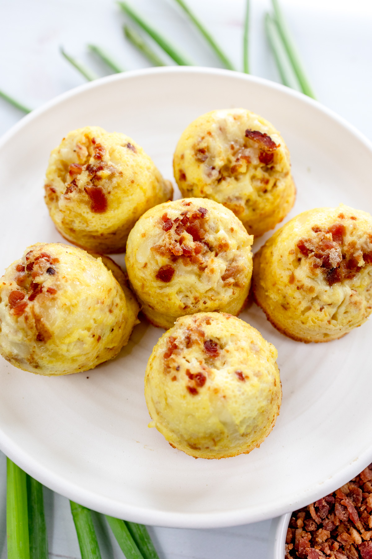 Close up shot of Air Fryer Egg Bites on a white plate.
