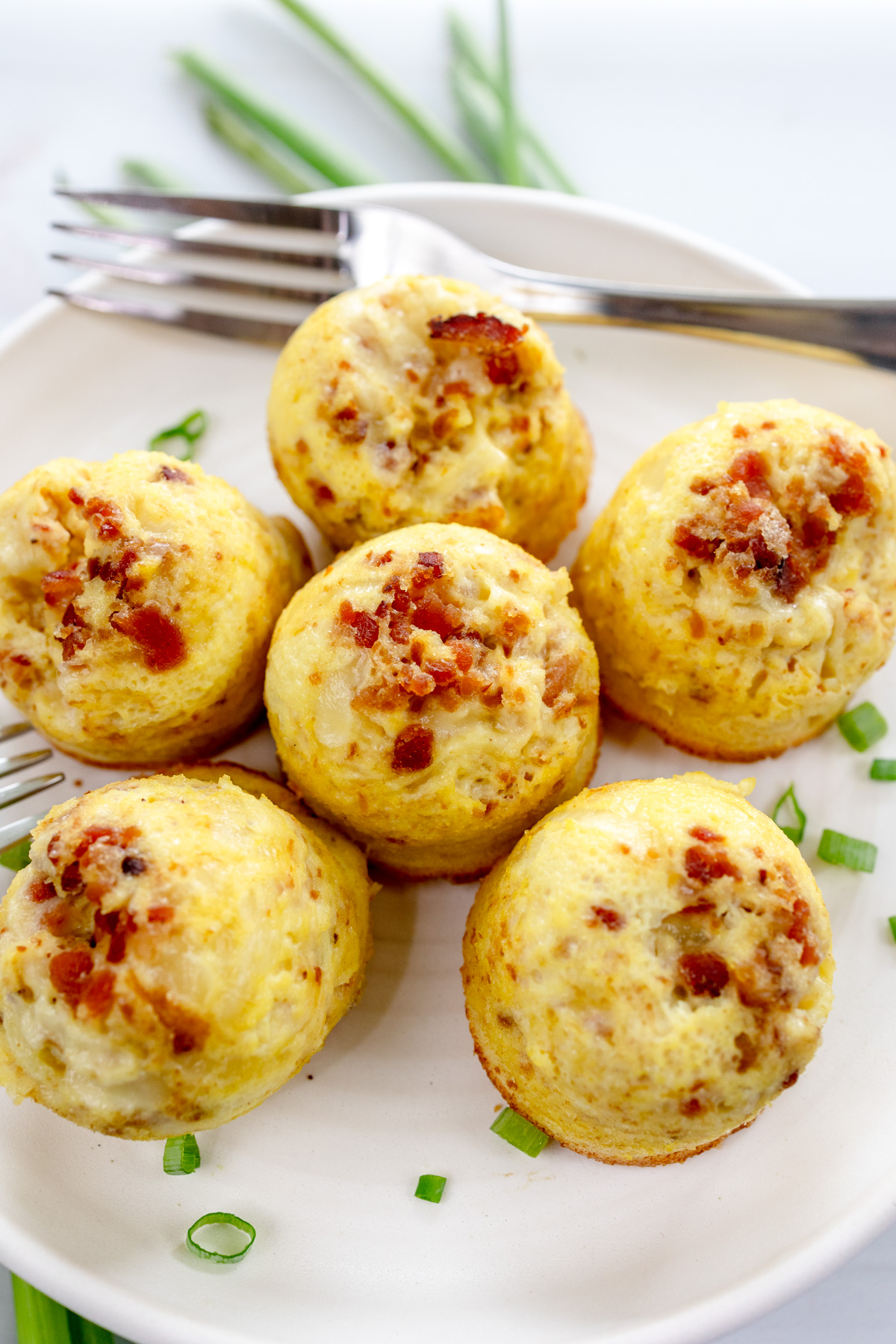 Close up shot of Air Fryer Egg Bites on a white plate.