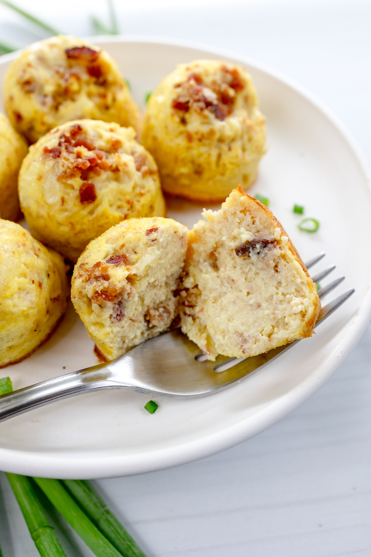 Close up shot of Air Fryer Egg Bites on a white plate.