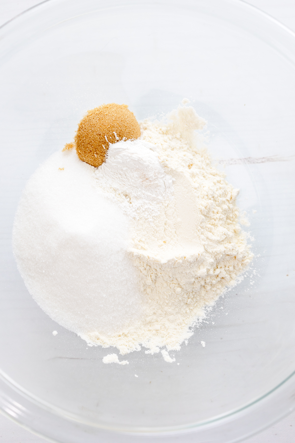 Overhead image of dry ingredients needed to make Air Fryer Peach Cobbler.