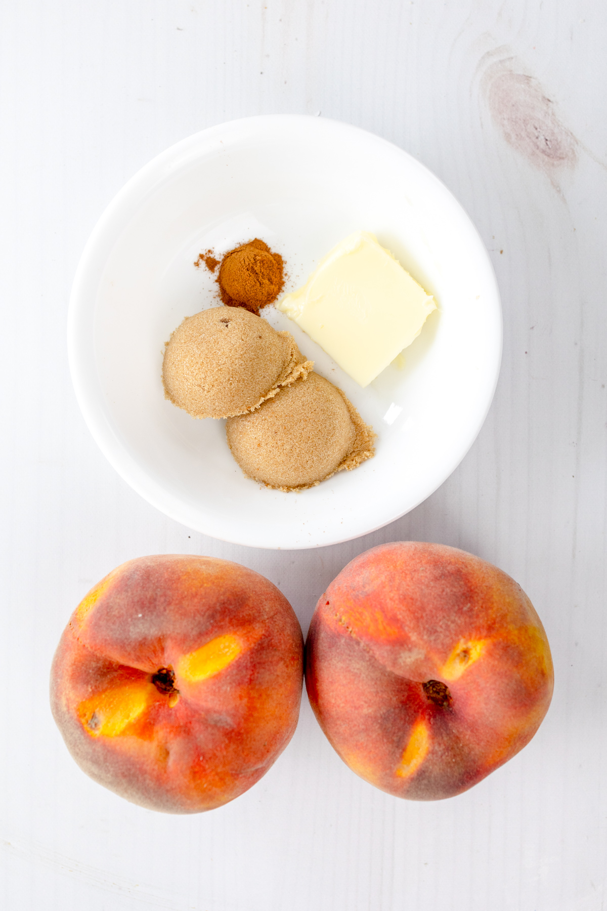 Overhead image of ingredients needed for Air Fryer Peaches.