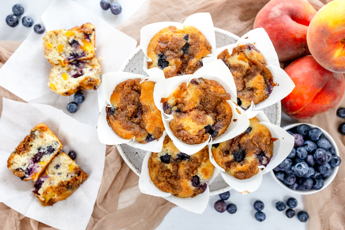 Overhead image of Blueberry Peach Muffins on a grey plate.