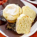 Square image of Cardamom Muffins on a white plate.