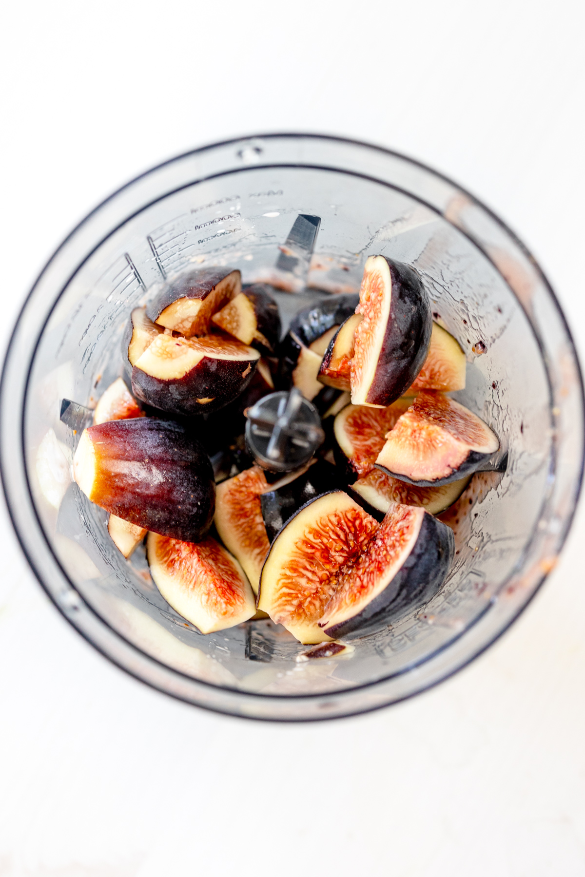Overhead view of figs in a blender.