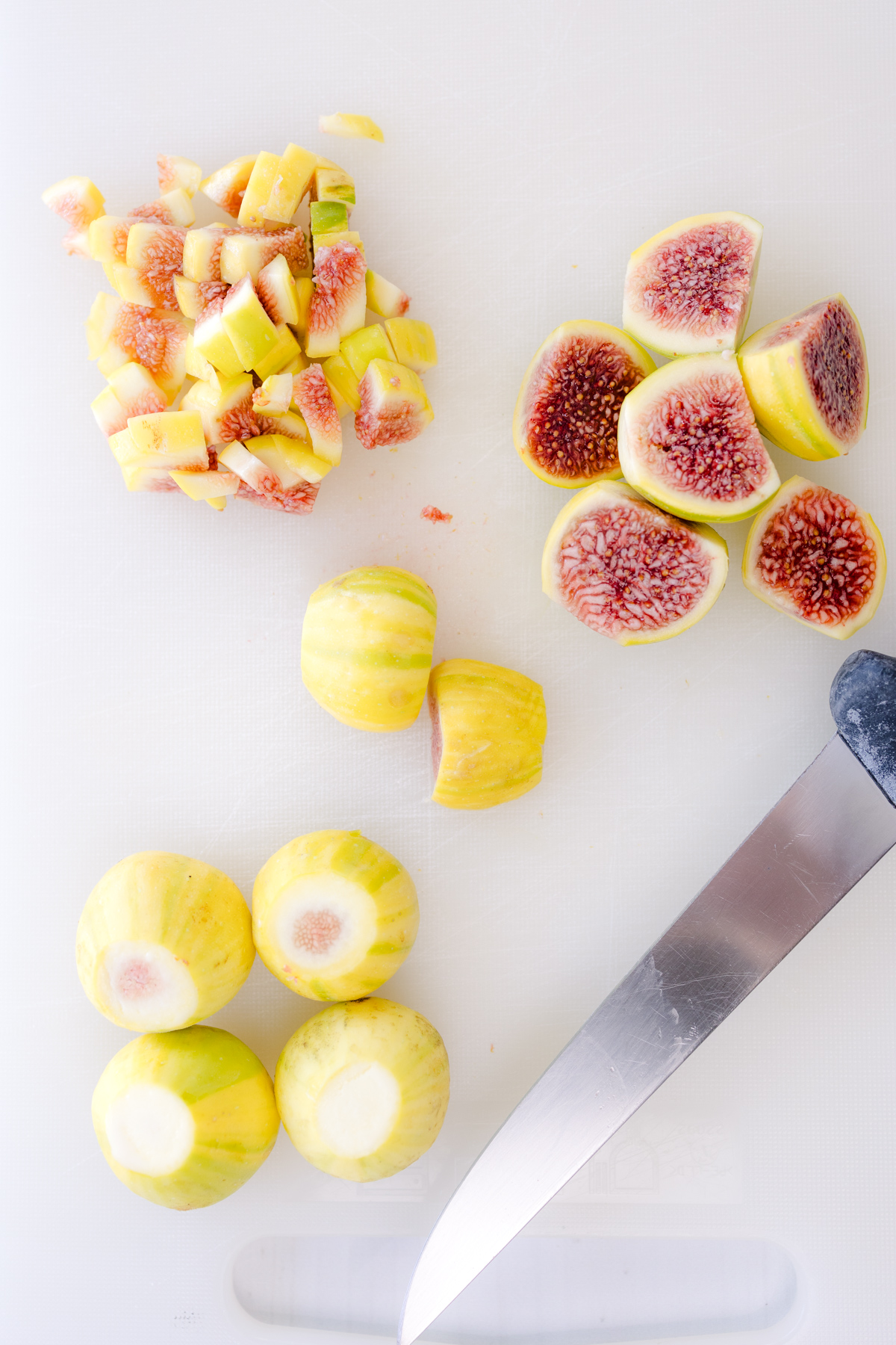 Overhead image of figs being sliced.