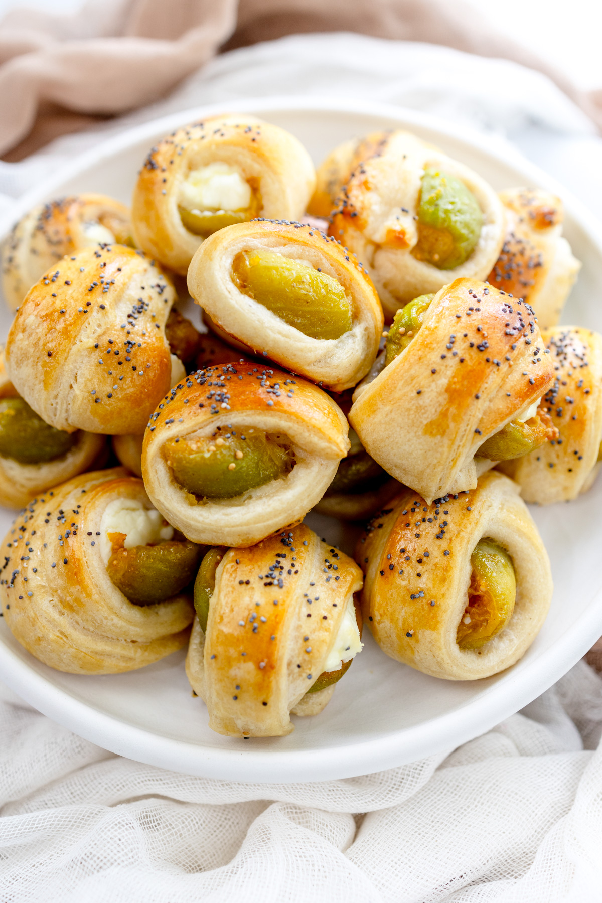 Overhead image of Figs in a Blanket on a white plate.