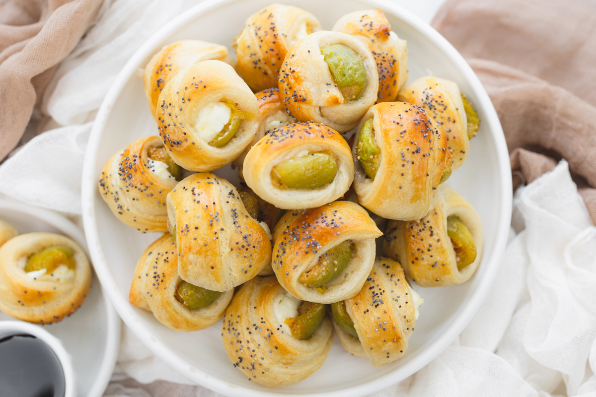 Overhead image of Figs in a Blanket on a white plate.