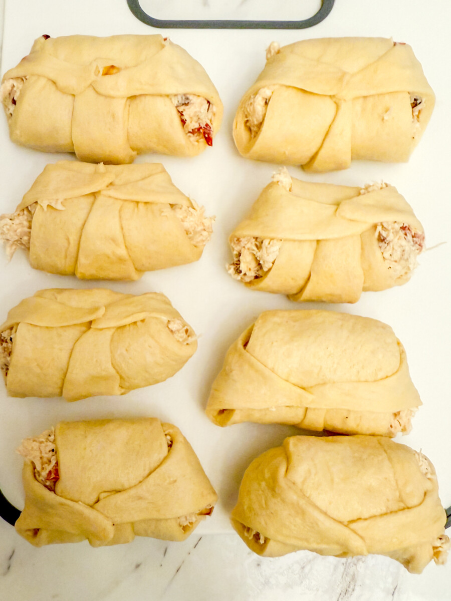 Pillsbury Crescent Roll Ups on cutting board