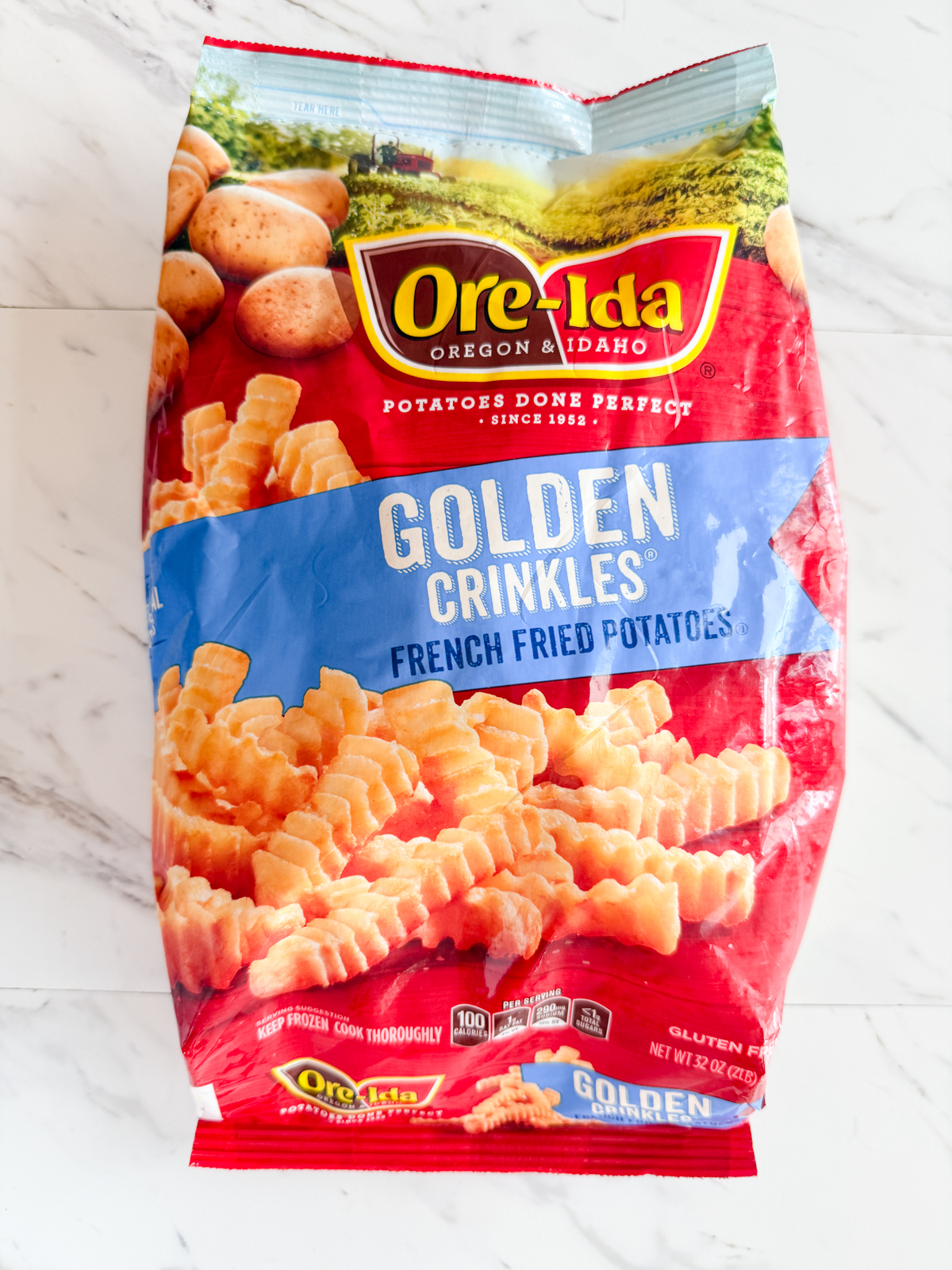 Overhead image of a bag of frozen crinkle cut fries.