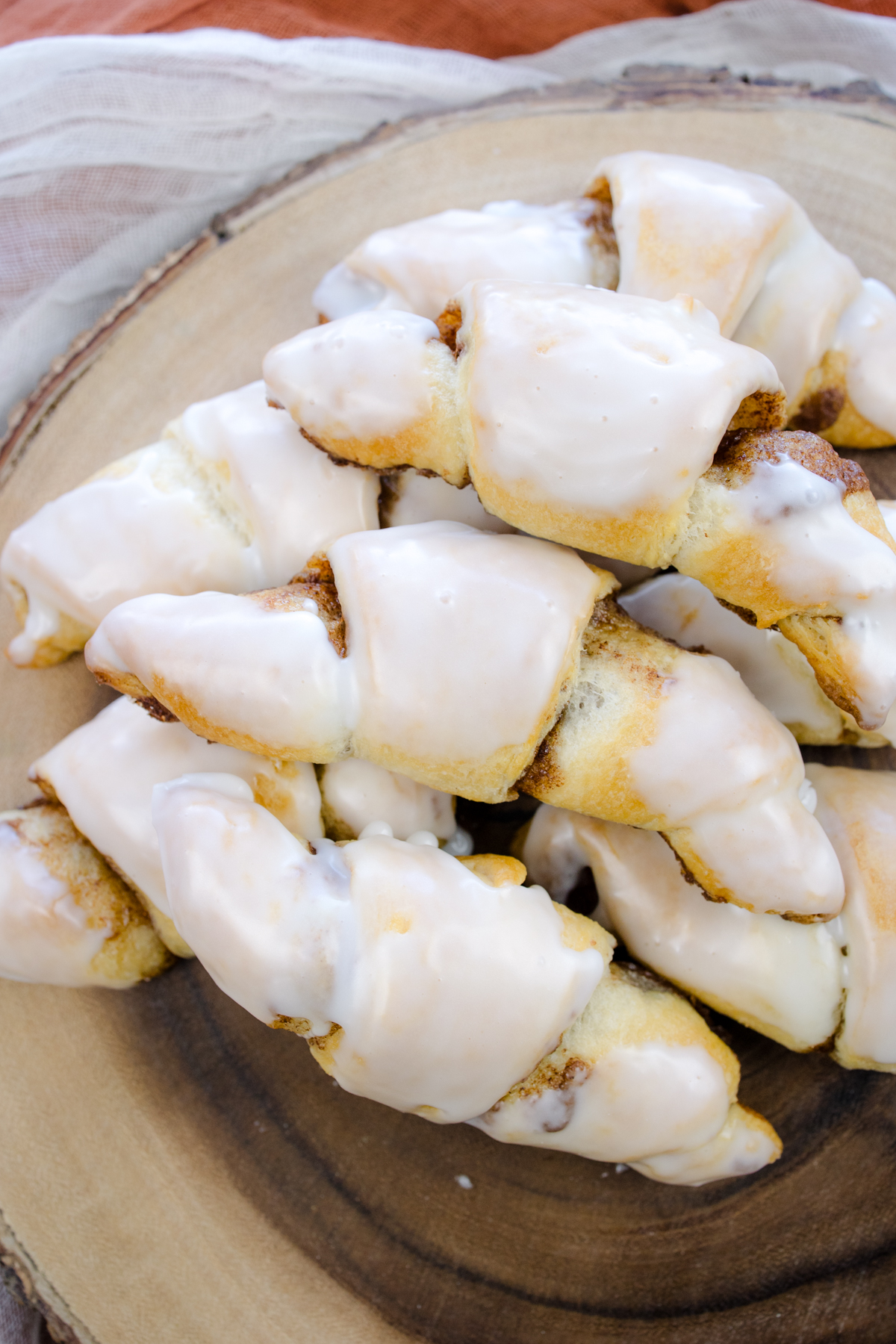 Overhead view of Cinnamon Crescent Rolls on a wooden surface.