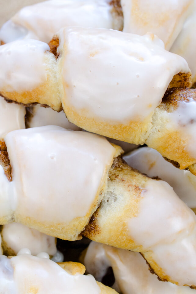 Overhead view of Cinnamon Crescent Rolls on a wooden surface.