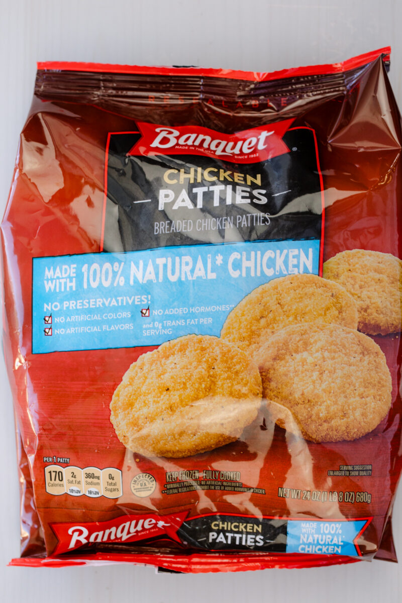 Overhead image of a bag of frozen chicken patties.