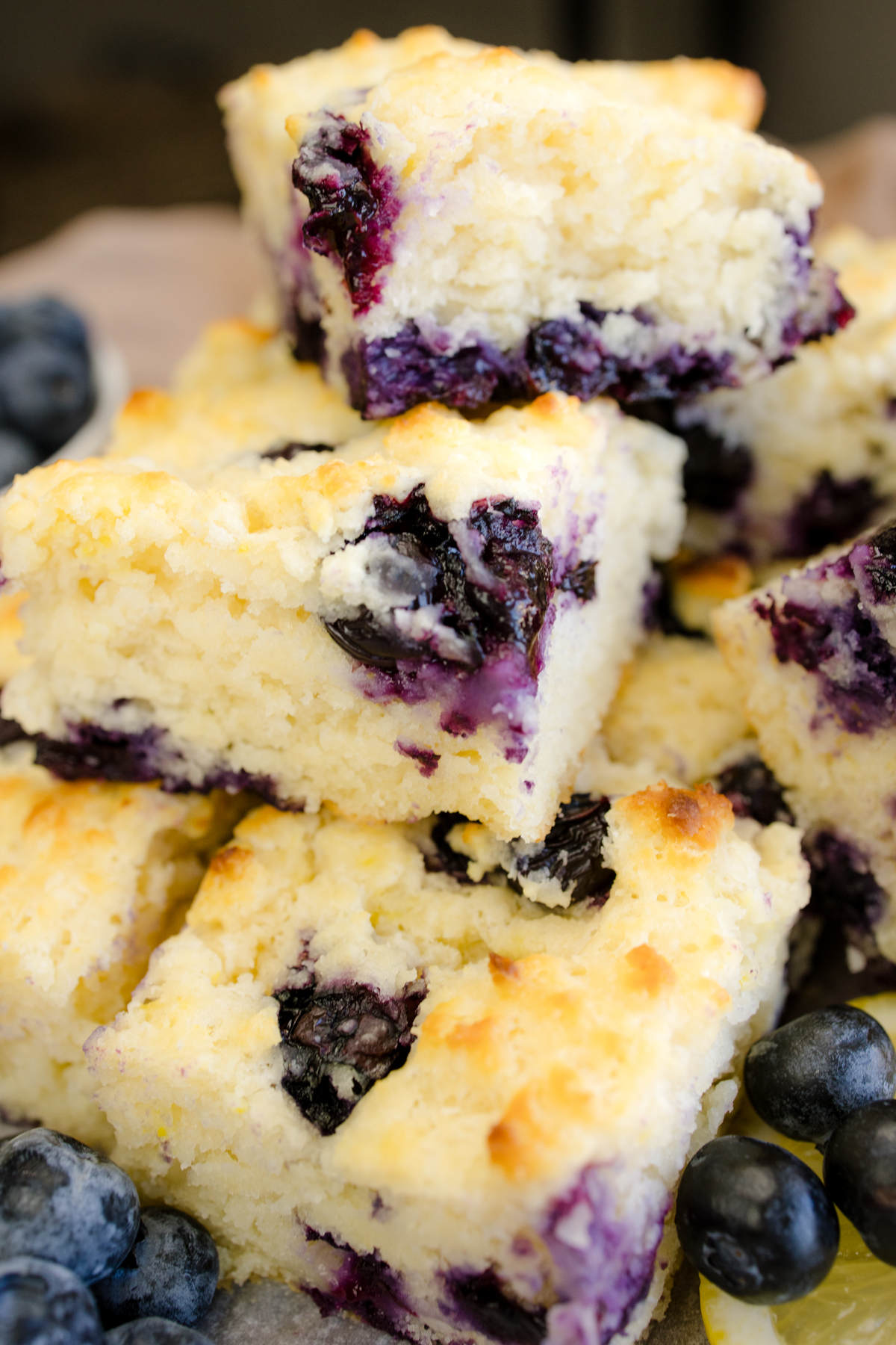 Angled view of Blueberry Biscuits stacked on top of each other.